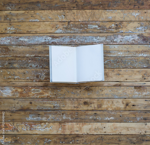 white book on an old wooden background