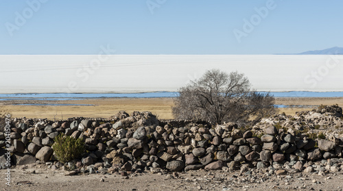 A rocky wall in Tahua, a small village by the Salar de Uyuni and Volcano Tunupa in Bolivia, South America photo