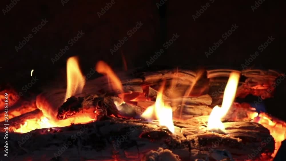 Hot coals and fire flames in fireplace, bonfire close-up. Hot coals and fire flames in fireplace, bonfire close-up.