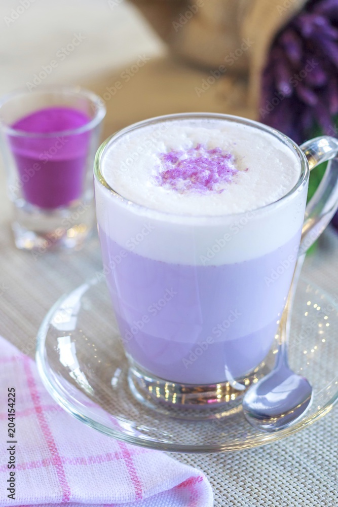 Hot macchiato of purple potato on the table Hot macchiato of purple potato on the table