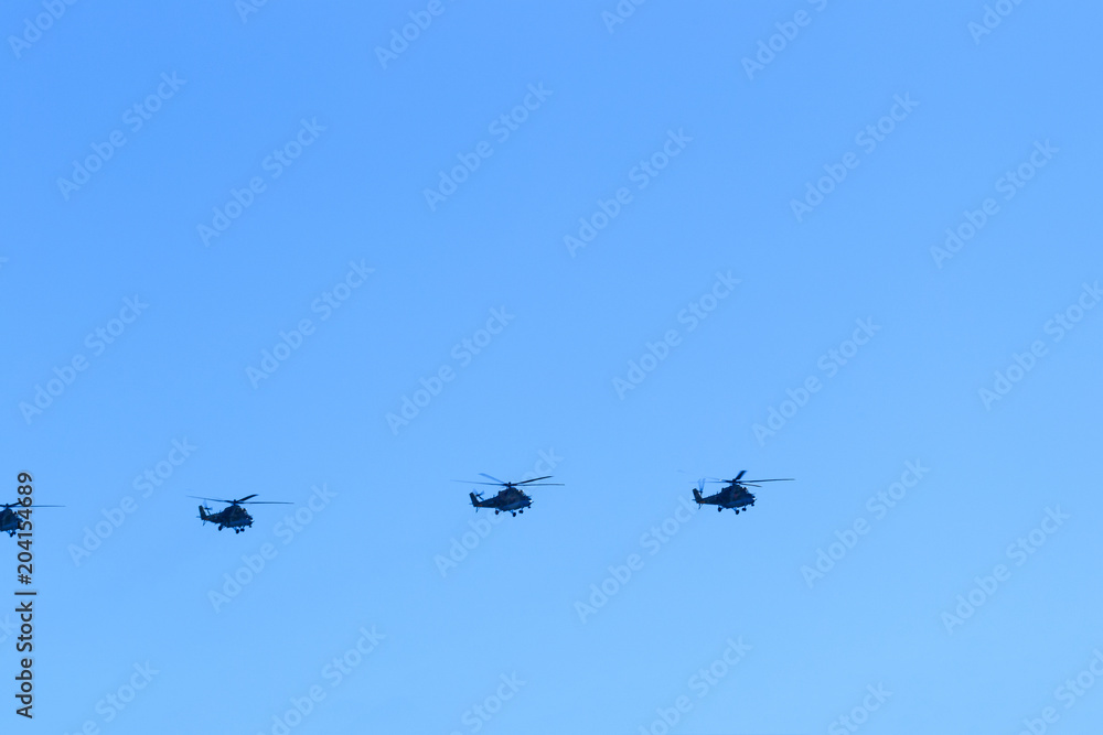 helicopters in the blue sky flying parade