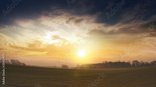 Sunrise . Sunset or sunrise with clouds, light rays and other atmospheric effect . Light from sky .