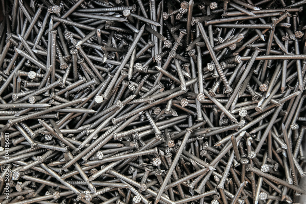 Metal steel nails in set. Fasteners for construction. Detailed background. Metal steel nails in set. Fasteners for construction. Detailed background.