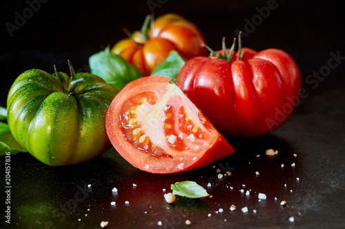 Segment of a sliced juicy ripe red tomato