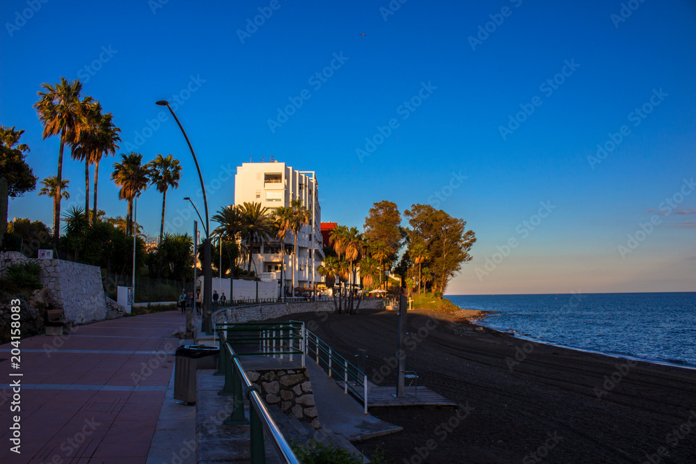Promenade. The promenade of Estepona in front of the sunset. Malaga province, Andalusia, Spain. Picture taken – 4 may 2018.