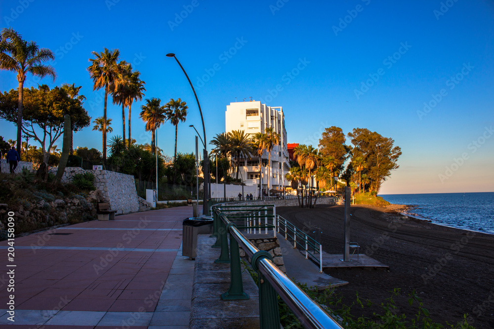 Promenade. The promenade of Estepona in front of the sunset. Malaga province, Andalusia, Spain. Picture taken – 4 may 2018.