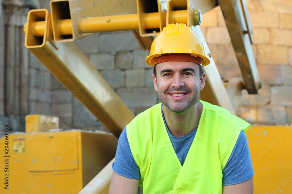 Sexy young construction worker smiling Sexy young construction worker smiling