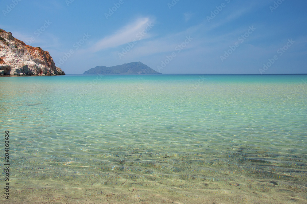 Turquoise lagoon of Plathiena beach at Milos island in Greece Turquoise lagoon of Plathiena beach at Milos island in Greece