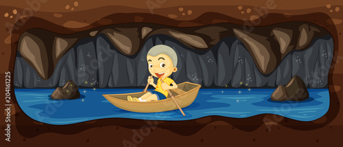 A Kid Riding a Boat in the River Cave