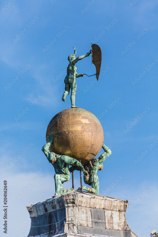 Statue of Men Holding Globe