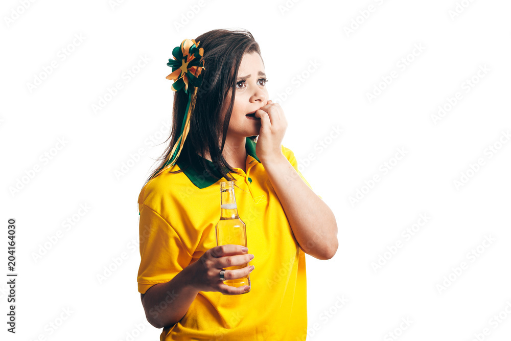 Brazilian female fan celebrating with beer on white background Brazilian female fan celebrating with beer on white background