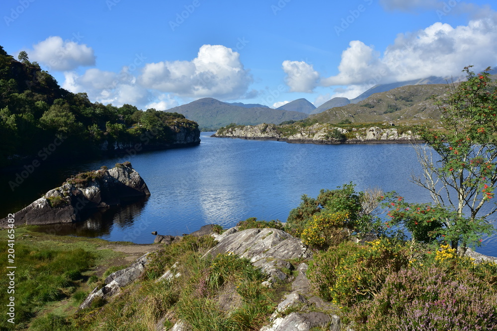 Lake among rock formations in Reeks mountain range in Kerry in Ireland.