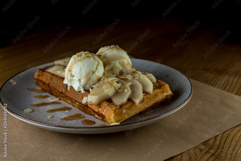 Belgian waffle with ice cream, caramel. With copy space for text, template or mockup Belgian waffle with ice cream, caramel. With copy space for text, template or mockup