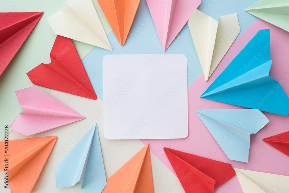 colourful paper airplane and blank white memo paper pad on colorful pastel  background. memo,list,organize and air mail concept Stock Photo | Adobe  Stock