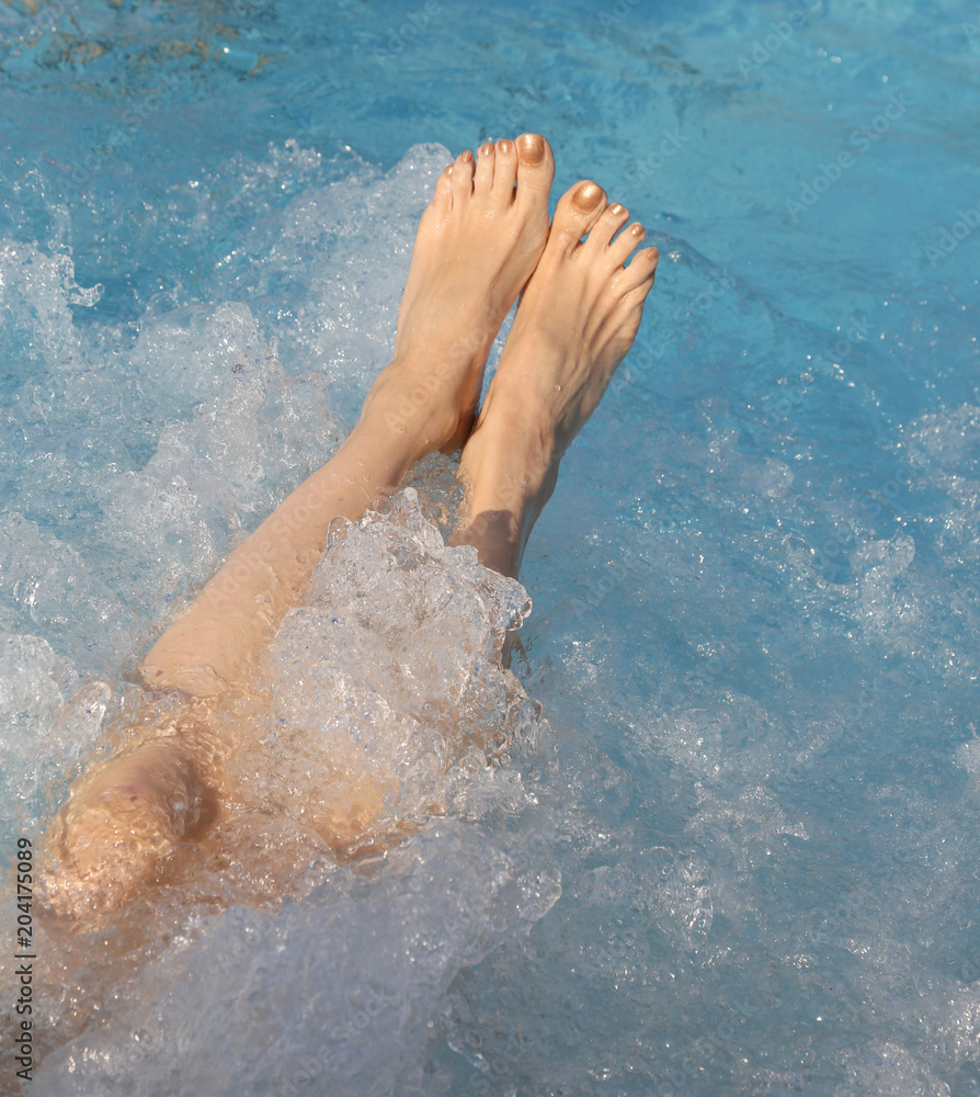 feet during the whirlpool therapy in the spa pool feet during the whirlpool therapy in the spa pool