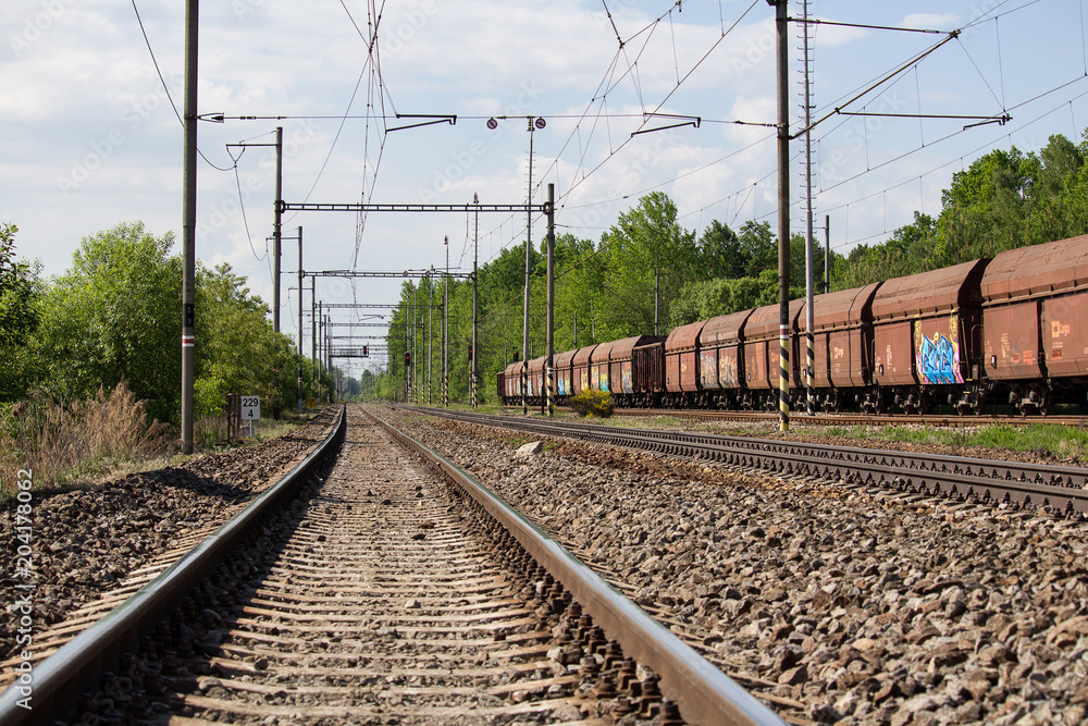 Railway track with old wagons parking on railway yard Railway track with old wagons parking on railway yard