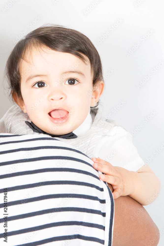 happy baby boy on his Mothers shoulder isolated on white happy baby boy on his Mothers shoulder isolated on white
