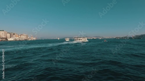 Ship is swiming in the bosporous - istanbul turkey photo