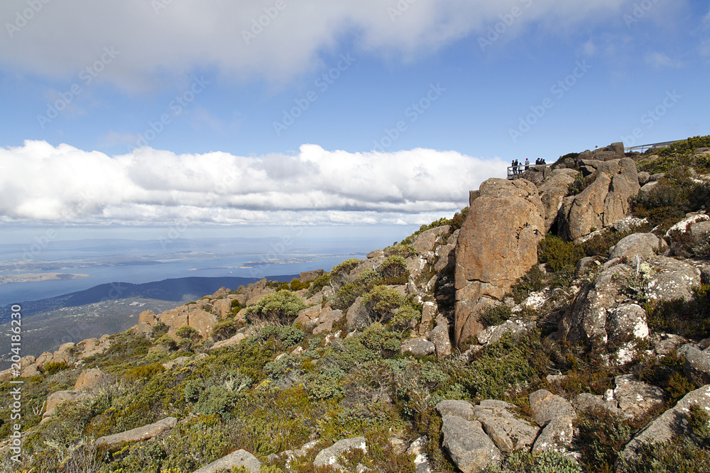 Tourists enjoy the view of Hobart from the observation point on the summit of Mount Wellington in Tasmania