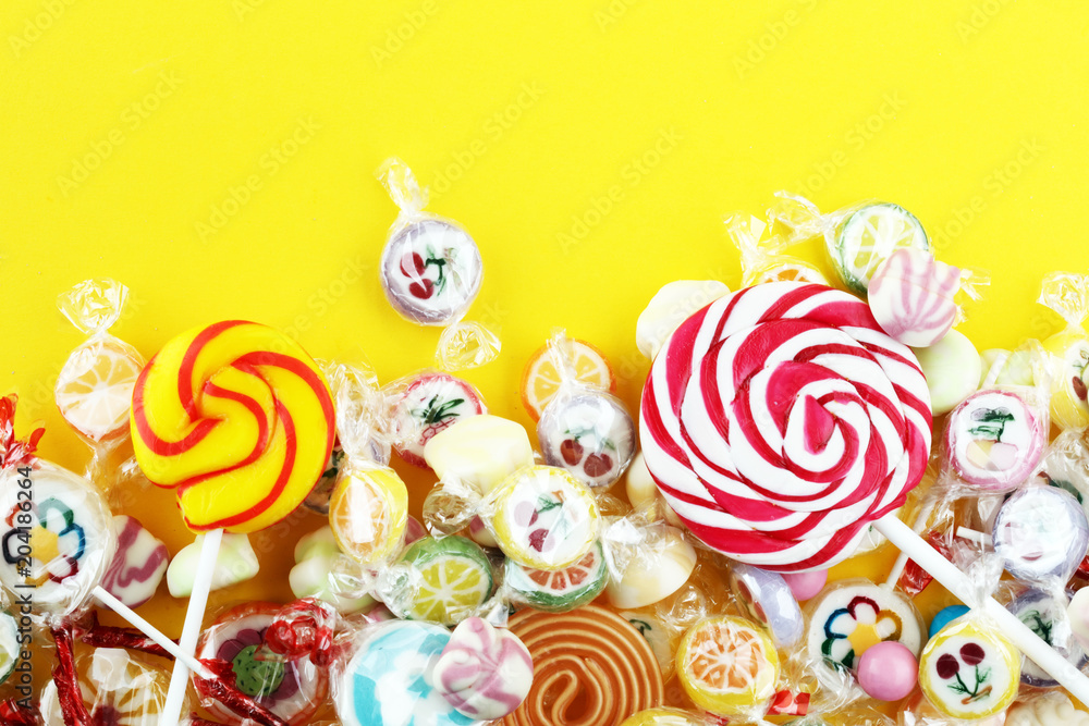 candies with jelly and sugar. colorful array of different childs sweets and treats. candies with jelly and sugar. colorful array of different childs sweets and treats.