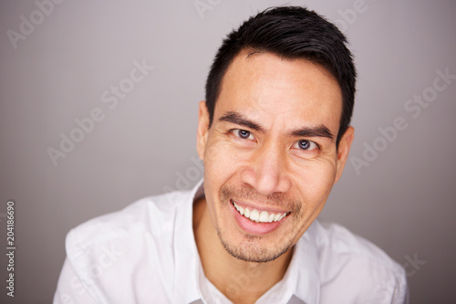 Middle aged asian man smiling