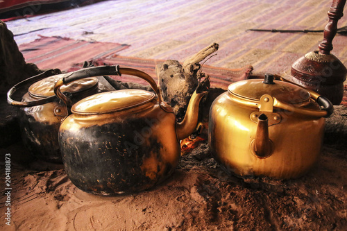 Traditional way of cooking Bedouin tea on an open fire in a desert Wadi Rum, Jordan