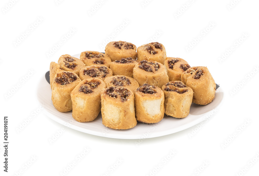 Indian Fried Bhakarwadi Tea Time Snack also known as bakarwadi, bakarvadi, bakar vadi, bakar wadi or spring roll is a traditional spicy Maharashtra and Gujarat Snack isolated on White Background Indian Fried Bhakarwadi Tea Time Snack also known as bakarwadi, bakarvadi, bakar vadi, bakar wadi or spring roll is a traditional spicy Maharashtra and Gujarat Snack isolated on White Background