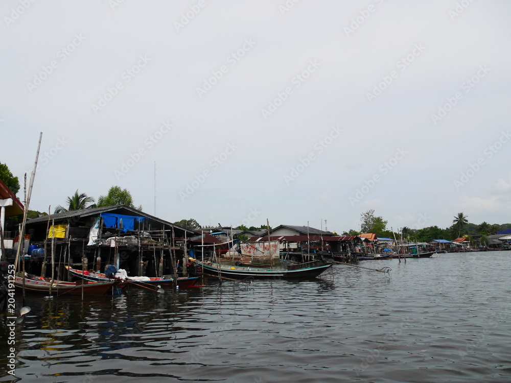Thai fisherman village and boat