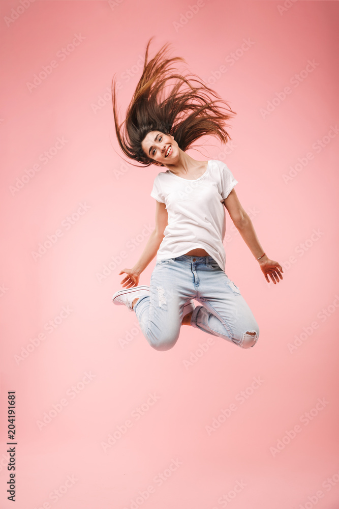 Full length of an excited young woman with long hair Full length of an excited young woman with long hair