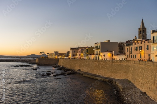 Waterfront in the coastal town of Alghero after sunset, Sardinia, Italy, Europe photo