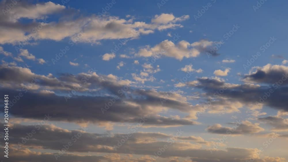 Moving clouds on sky at sunset. Nature background.
Moving clouds on sky at sunset. Nature background.
