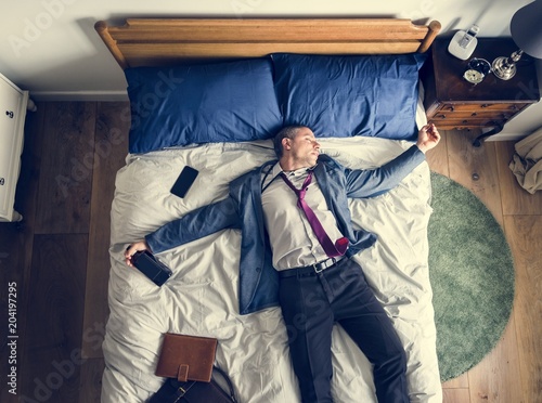 Drunk business man falling asleep as soon as he came back home