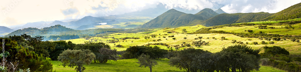 Scenic view of Plaine des Cafres plateau with Piton des Neiges massif in background, Reunion Island
