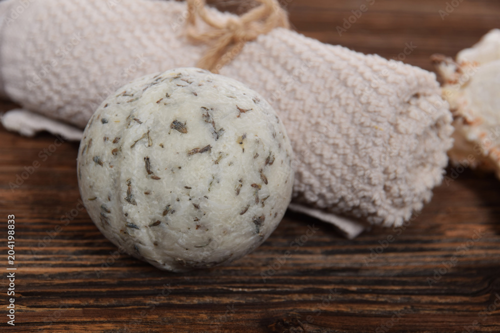 lonely relaxation ball for bath white clean towel on a brown background lonely relaxation ball for bath white clean towel on a brown background