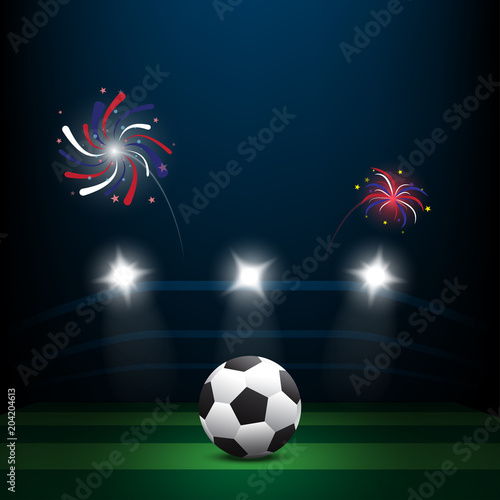 Soccer ball on green lawn with firework at night
