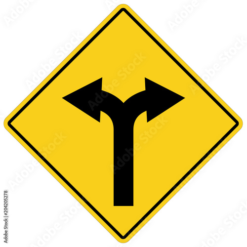 yellow sign with two arrows. fork road yellow warning symbol. two directions on yellow road sign.
