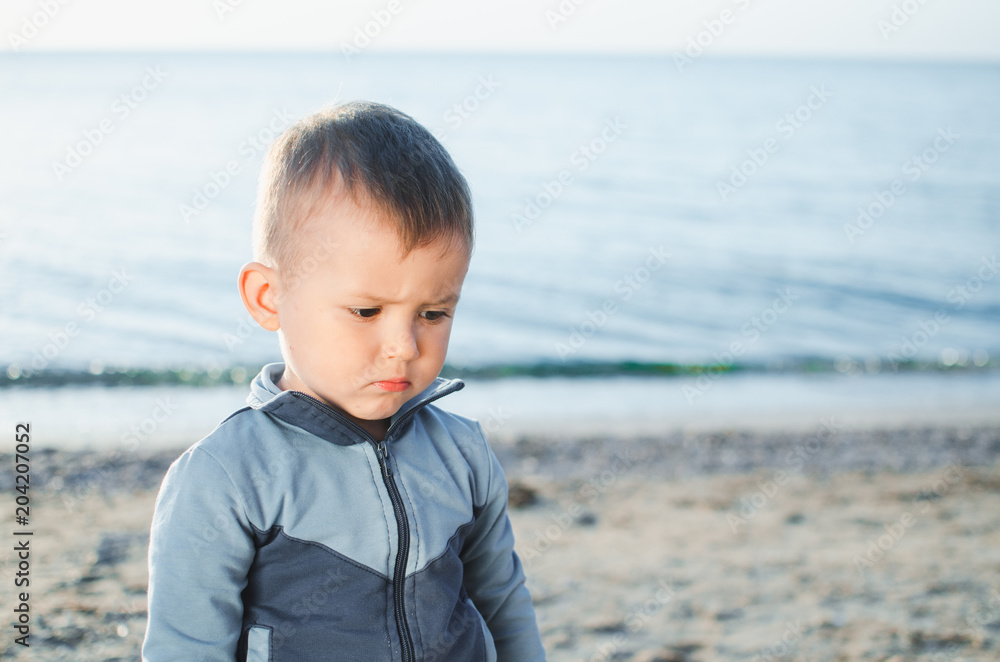 sad little boy on the sea, lost an orphan hurt sad little boy on the sea, lost an orphan hurt