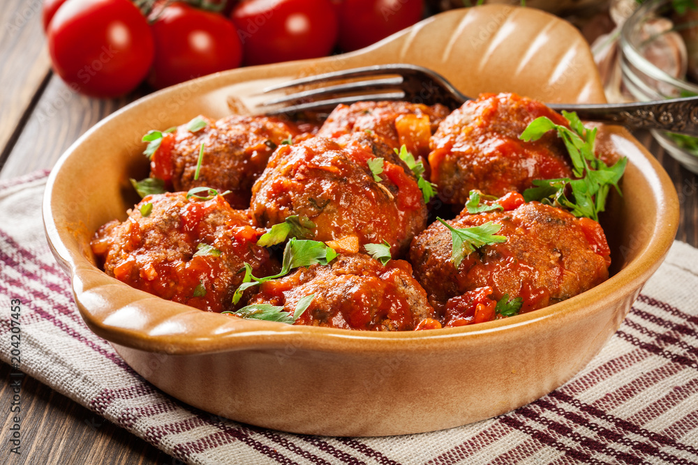Pork meatballs with spicy tomato sauce in dish