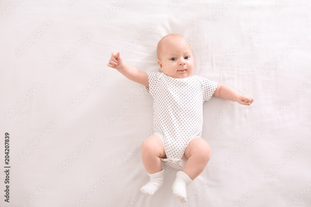 Cute little baby lying on bed Cute little baby lying on bed