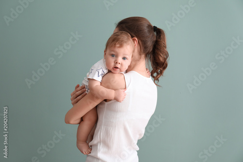 Young mother with her cute ...