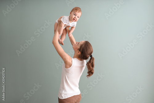 Young mother with her cute ...