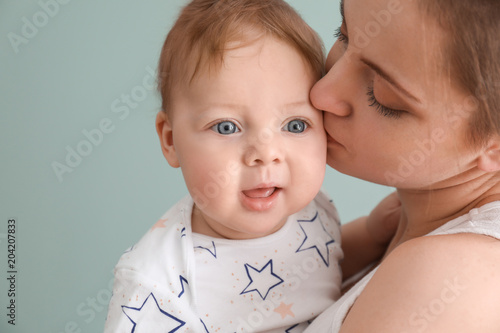 Young mother with her cute ...