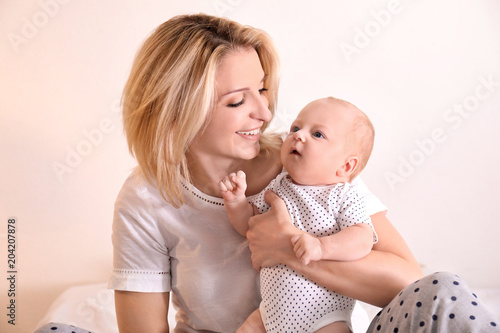 Young mother and her baby o...