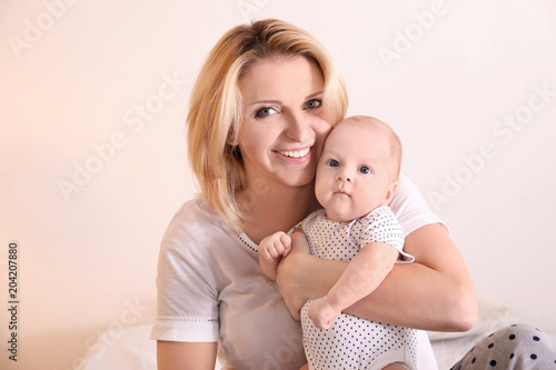 Young mother and her baby o...