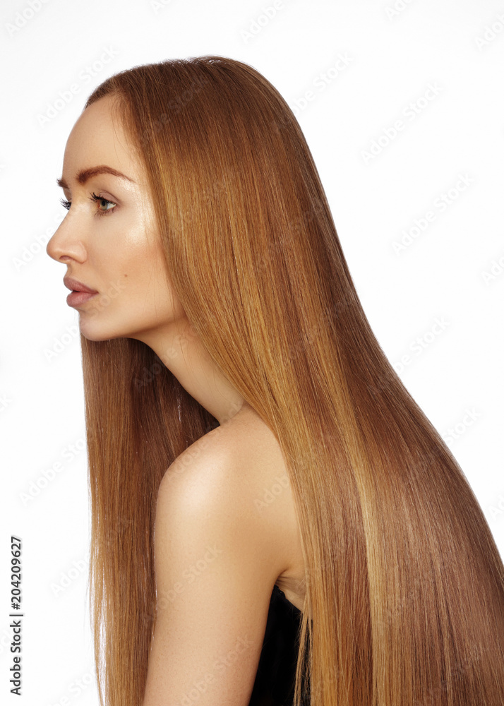 Naklejka premium Beautiful yong woman with long straight shiny hair. Sexy fashion model with smooth gloss hairstyle. Keratin treatment