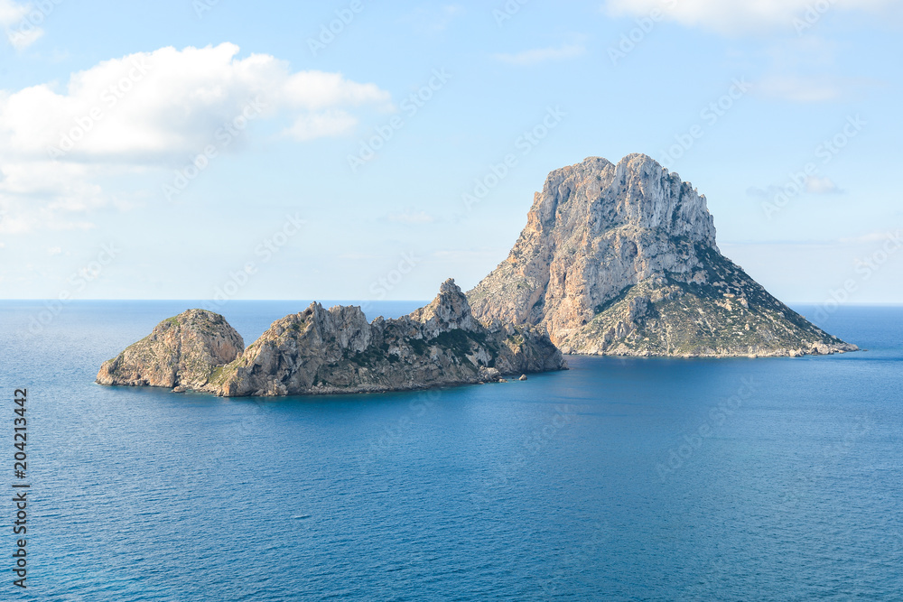 Ibiza, Spain - October 5, 2017 : Beautiful view of big stone island Es Vedra of Ibiza, Balearic islands, Spain. Sea rest and holiday concept. View from water. Popular summer resort.