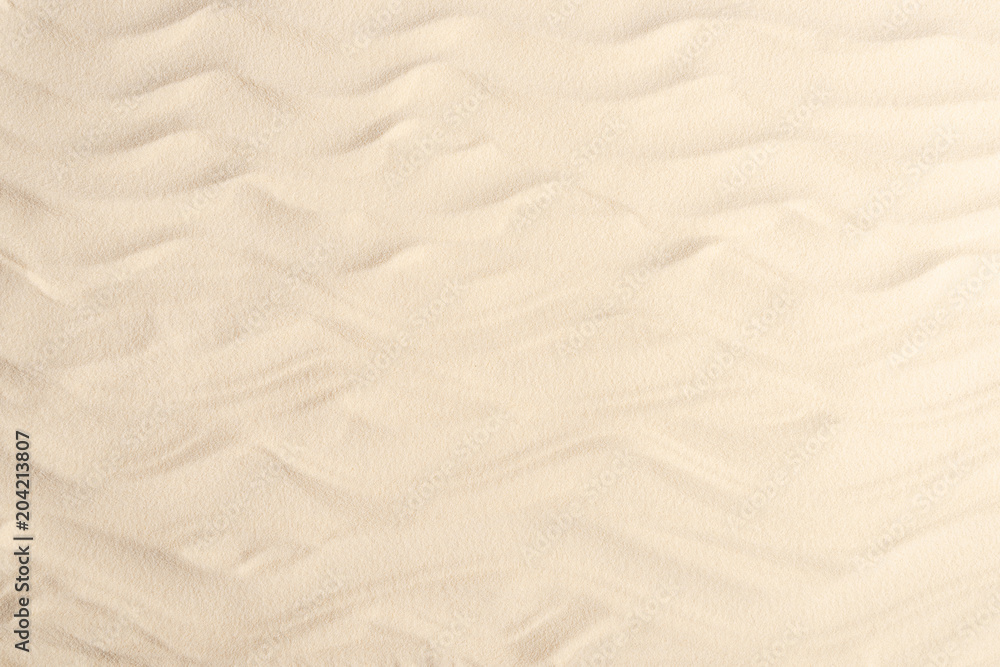 Obraz premium Waves on light sand for summer travel background