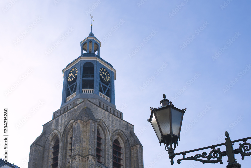 Clock in the old town of Bergen op Zoom, the Netherlands. Blue sky. Tourism