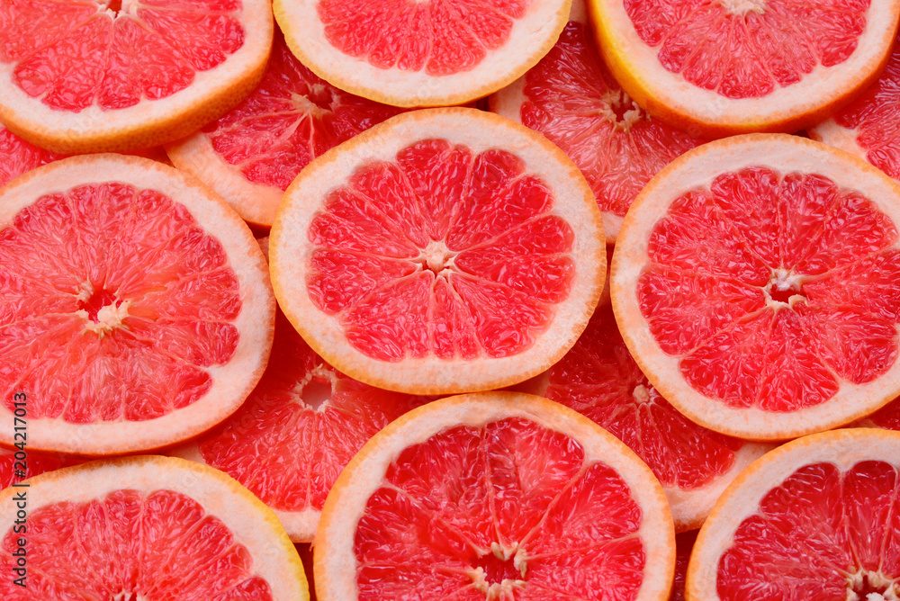 Grapefruit red juicy slices background. top view Grapefruit red juicy slices background. top view