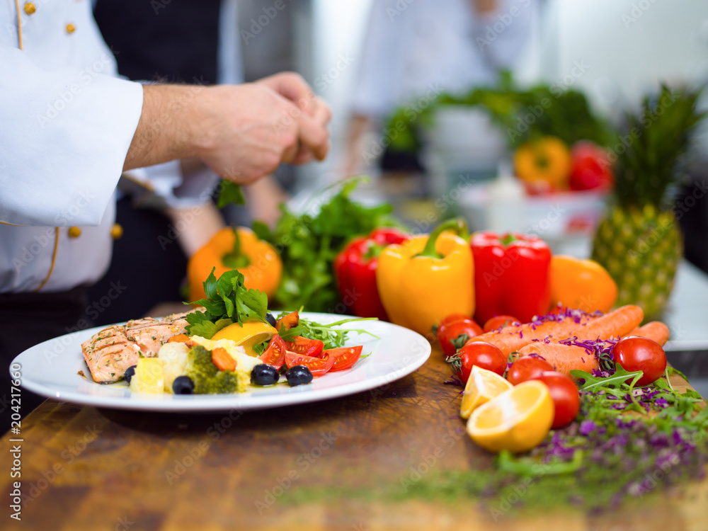 cook chef decorating garnishing prepared meal cook chef decorating garnishing prepared meal
